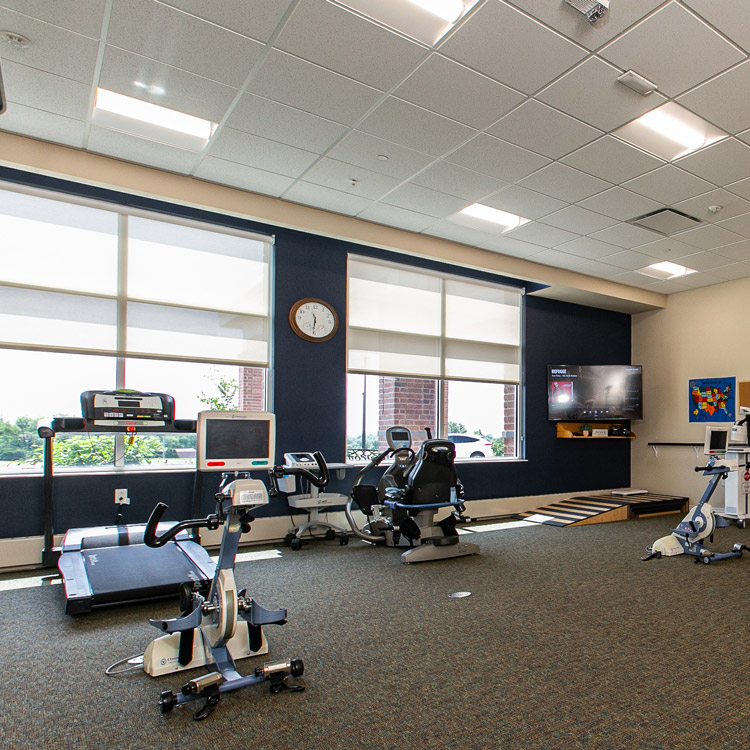 Hawkeye Care Center exercise room with a treadmill and other exercise equipment